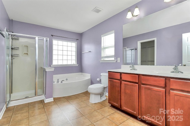 full bathroom with visible vents, toilet, a sink, a shower stall, and tile patterned floors