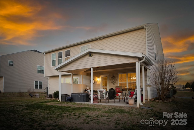 back of property featuring a patio