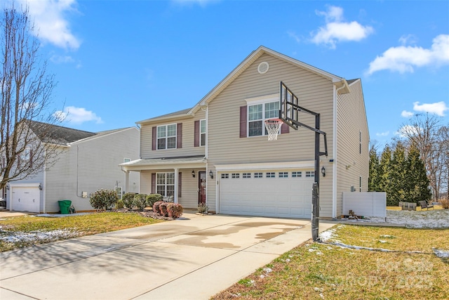 traditional-style home with concrete driveway, a front lawn, and an attached garage