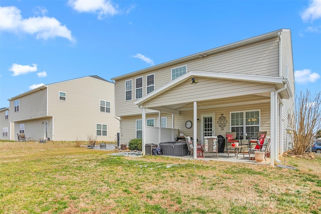 back of property featuring a patio and a lawn