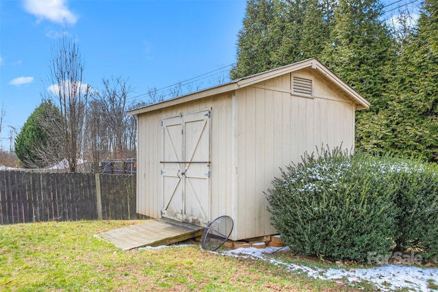 view of shed with fence