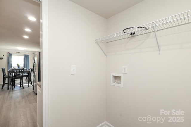 washroom featuring washer hookup, recessed lighting, wood finished floors, laundry area, and baseboards