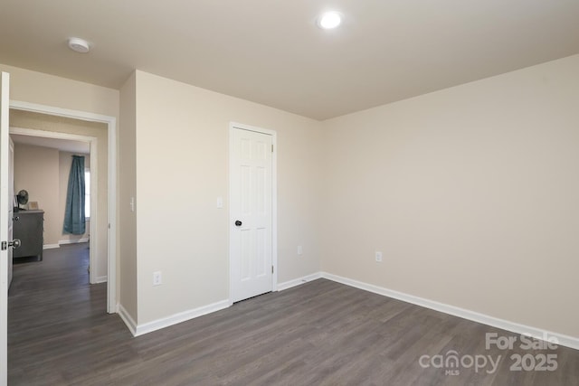 unfurnished bedroom featuring recessed lighting, dark wood finished floors, and baseboards