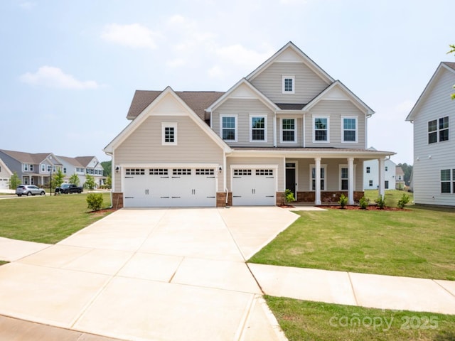 craftsman house featuring covered porch, stone siding, a front lawn, and concrete driveway