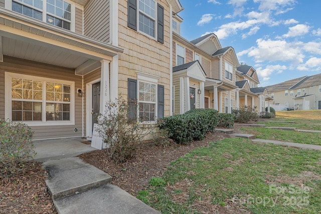 view of property exterior featuring a yard