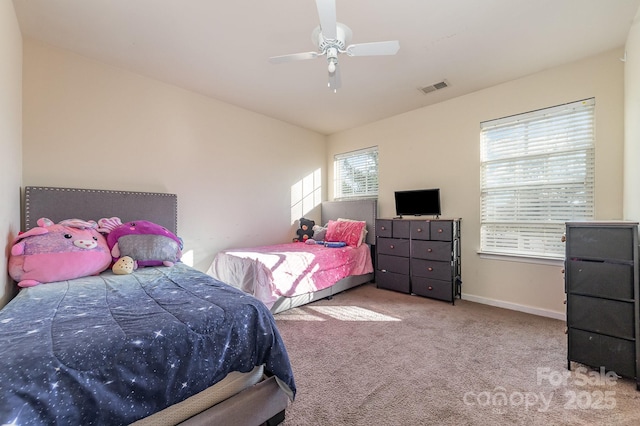 carpeted bedroom with ceiling fan and lofted ceiling