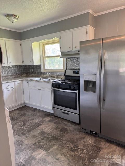 948 Shannon Bradley Rd, Gastonia, NC 28052 - kitchen with stainless steel appliances, under cabinet range hood, ornamental molding, white cabinetry, and backsplash