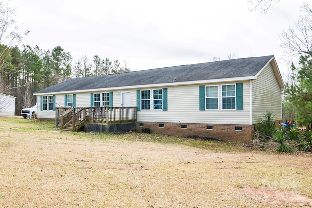 view of front of house with crawl space, a front yard, and a wooden deck