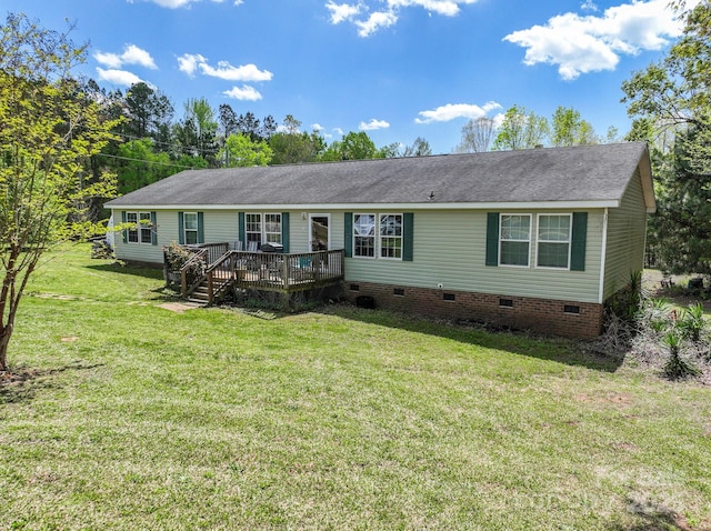 view of front of property with a shingled roof, crawl space, a wooden deck, and a front lawn