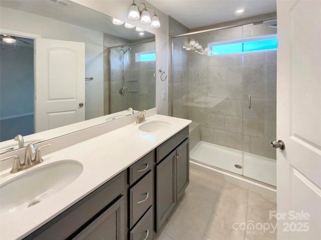 bathroom with vanity, tile patterned flooring, and an enclosed shower