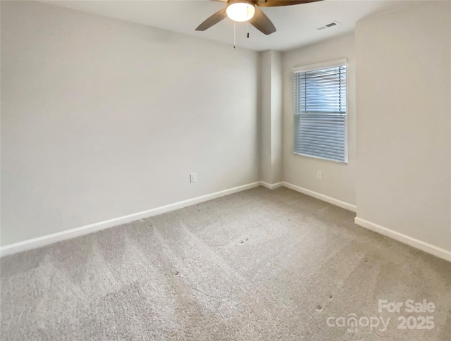 empty room with ceiling fan and carpet