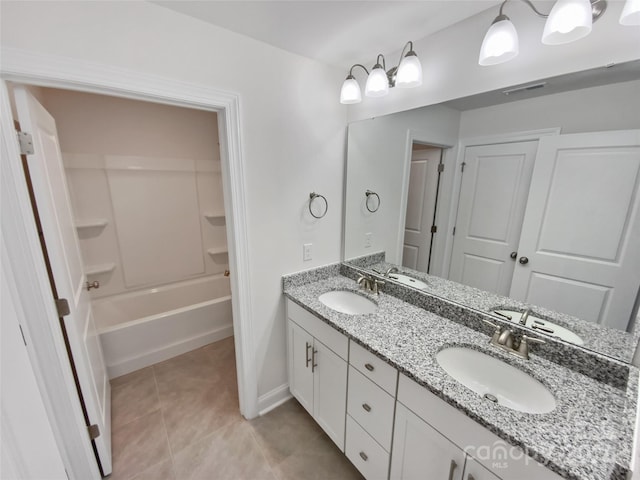 bathroom with tile patterned floors, vanity, and tub / shower combination