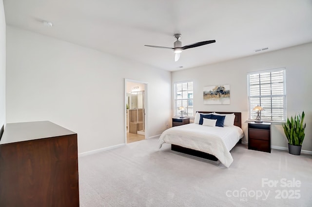 bedroom with baseboards, a ceiling fan, visible vents, and light colored carpet