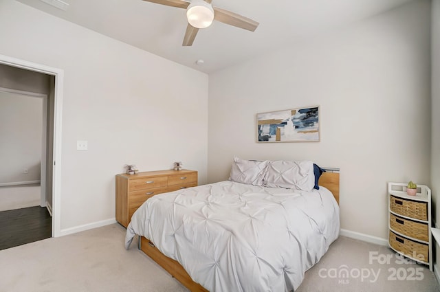 bedroom with carpet flooring, a ceiling fan, and baseboards