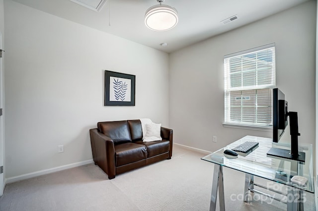 office with baseboards, light colored carpet, visible vents, and attic access