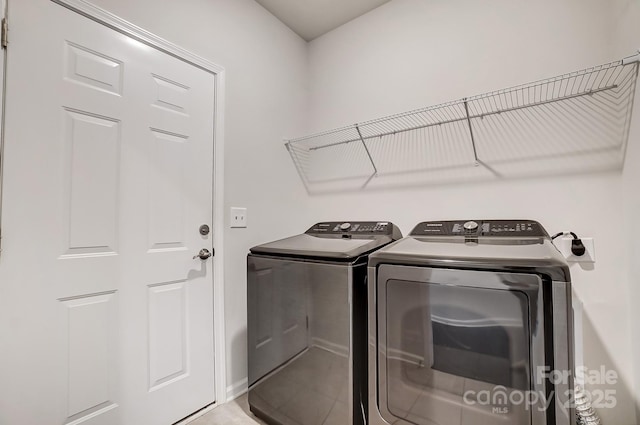 laundry room with laundry area and separate washer and dryer