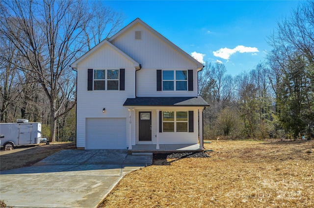 traditional home featuring an attached garage and concrete driveway