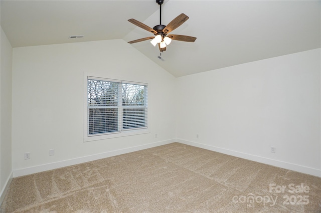 unfurnished room with ceiling fan, lofted ceiling, light carpet, visible vents, and baseboards