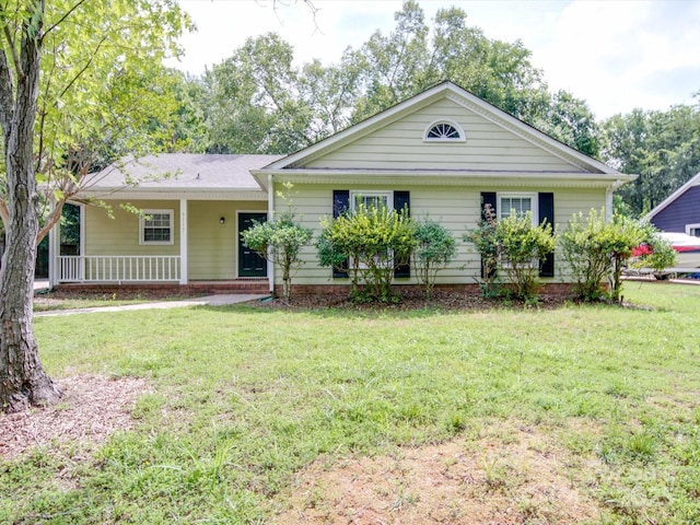 single story home featuring a porch and a front yard