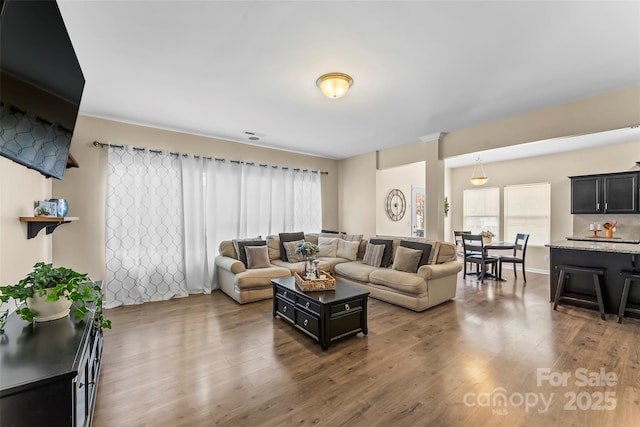 living area with wood finished floors