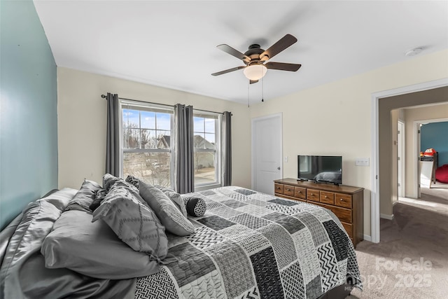 bedroom with ceiling fan, carpet floors, and baseboards