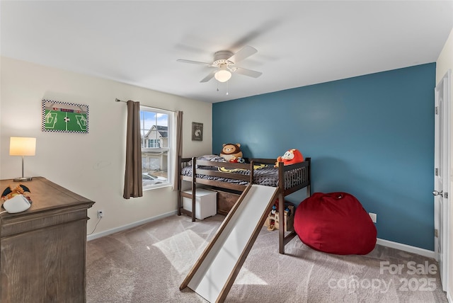 bedroom with light carpet, ceiling fan, and baseboards