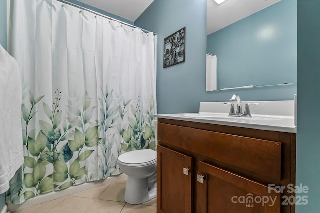 bathroom with toilet, tile patterned flooring, vanity, and a shower with curtain