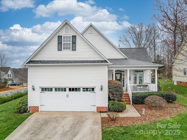 traditional-style home featuring a porch, a garage, concrete driveway, roof with shingles, and a front yard