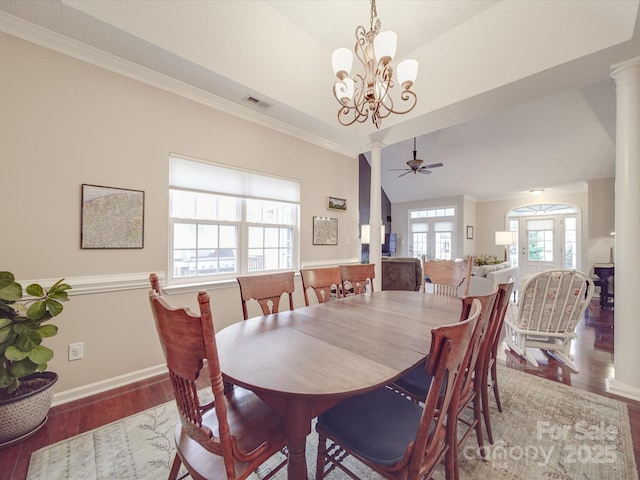 dining area featuring crown molding, ornate columns, visible vents, dark wood-type flooring, and baseboards