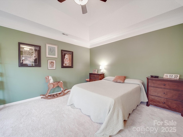 bedroom with crown molding, visible vents, a ceiling fan, and light colored carpet