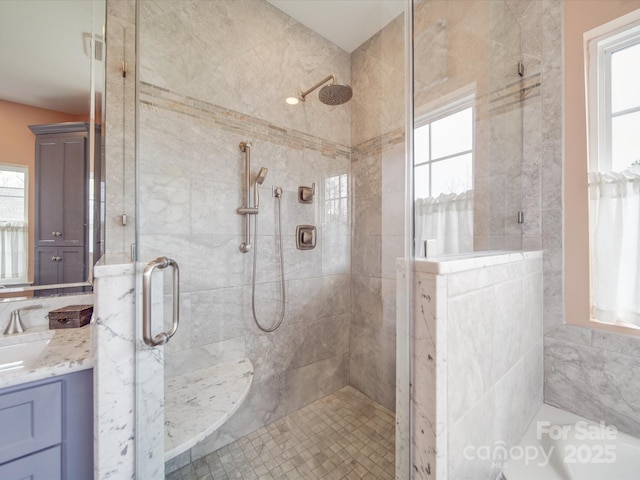 full bathroom featuring a shower stall and vanity