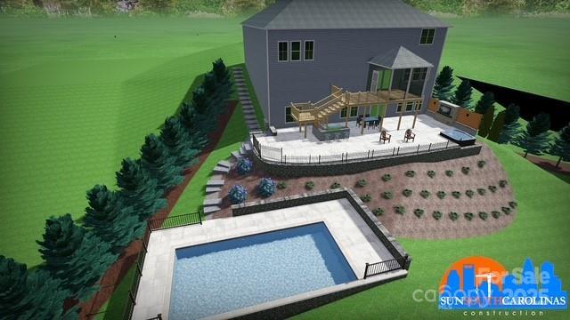 rear view of property with fence, an outdoor pool, and a patio