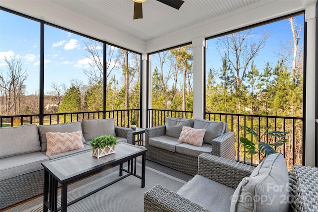 sunroom featuring a ceiling fan