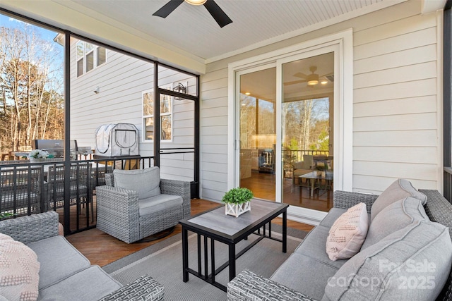 sunroom / solarium with ceiling fan