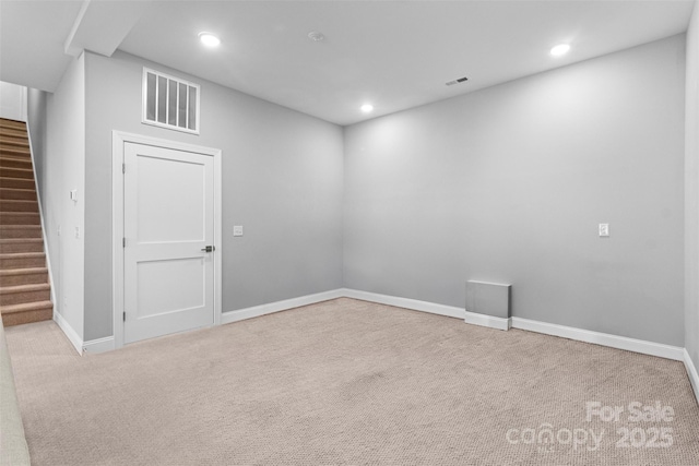 carpeted empty room with stairs, baseboards, visible vents, and recessed lighting