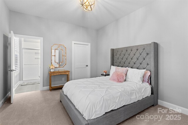 bedroom with carpet floors and baseboards