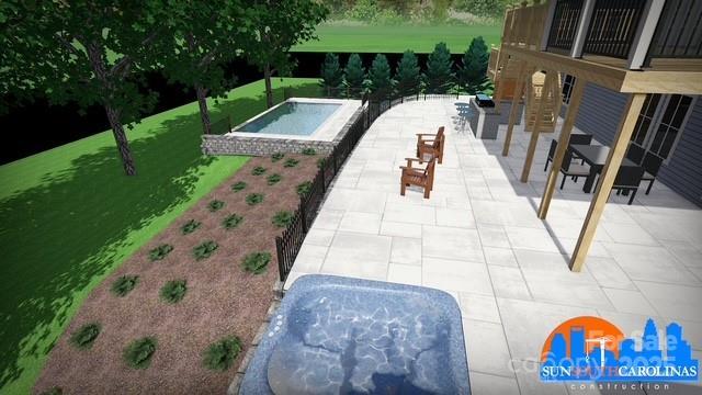 view of swimming pool with a patio, a lawn, and an in ground hot tub