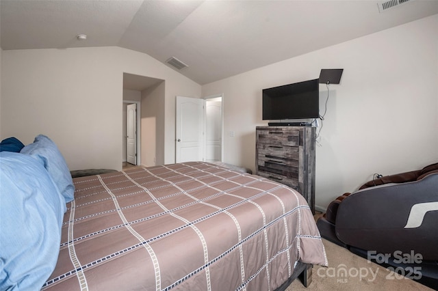 carpeted bedroom with lofted ceiling and visible vents