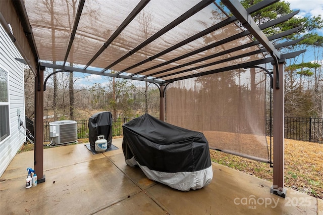 view of patio featuring fence, cooling unit, and a pergola