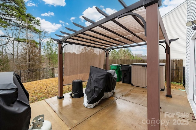 view of patio / terrace featuring a carport, a fenced backyard, and a pergola