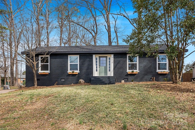 single story home featuring roof with shingles, brick siding, crawl space, and a front lawn