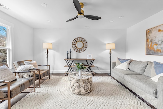 5825 Ruth Dr, Charlotte, NC 28215 - living area featuring light wood finished floors, visible vents, and baseboards