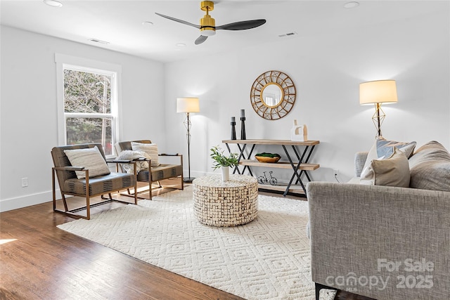5825 Ruth Dr, Charlotte, NC 28215 - living area with baseboards, visible vents, ceiling fan, and wood finished floors
