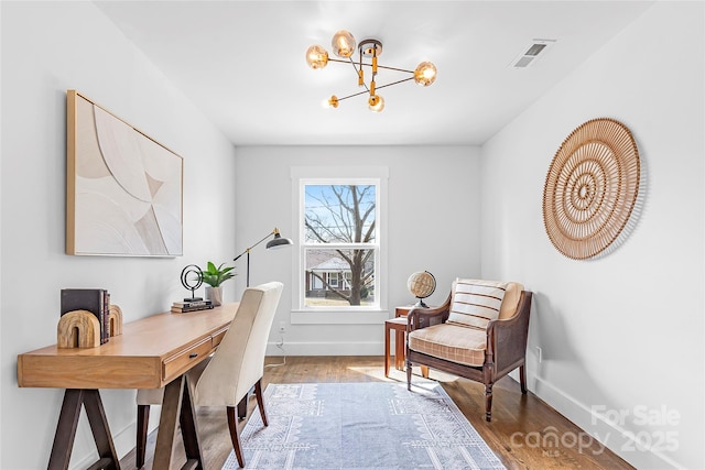 5825 Ruth Dr, Charlotte, NC 28215 - office space featuring visible vents, a notable chandelier, baseboards, and wood finished floors