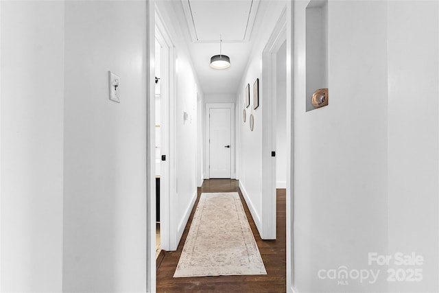 5825 Ruth Dr, Charlotte, NC 28215 - hallway with attic access, baseboards, and dark wood-type flooring