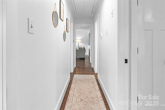 5825 Ruth Dr, Charlotte, NC 28215 - hallway with dark wood-style floors, attic access, and baseboards