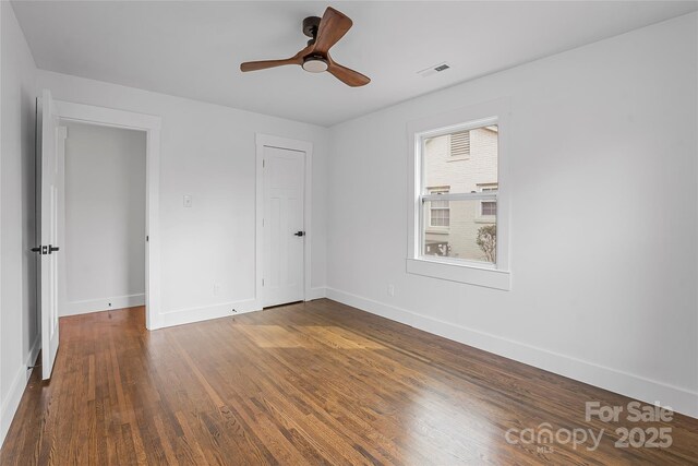 5825 Ruth Dr, Charlotte, NC 28215 - unfurnished bedroom featuring baseboards, visible vents, and wood finished floors