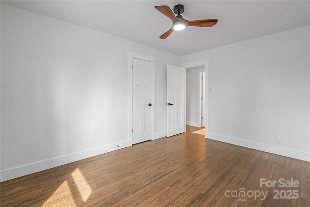 5825 Ruth Dr, Charlotte, NC 28215 - unfurnished bedroom featuring wood finished floors, a ceiling fan, and baseboards