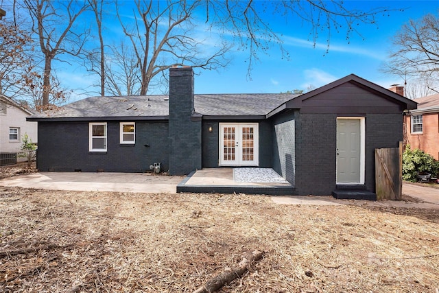 5825 Ruth Dr, Charlotte, NC 28215 - rear view of house featuring a patio area, french doors, brick siding, and a chimney