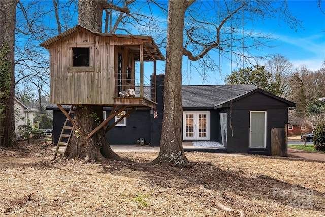 5825 Ruth Dr, Charlotte, NC 28215 - exterior space featuring french doors and a shingled roof